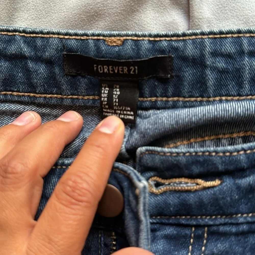 2 forever 21 jeans and 1 almost famous jeans brand ( total of 3 jeans )